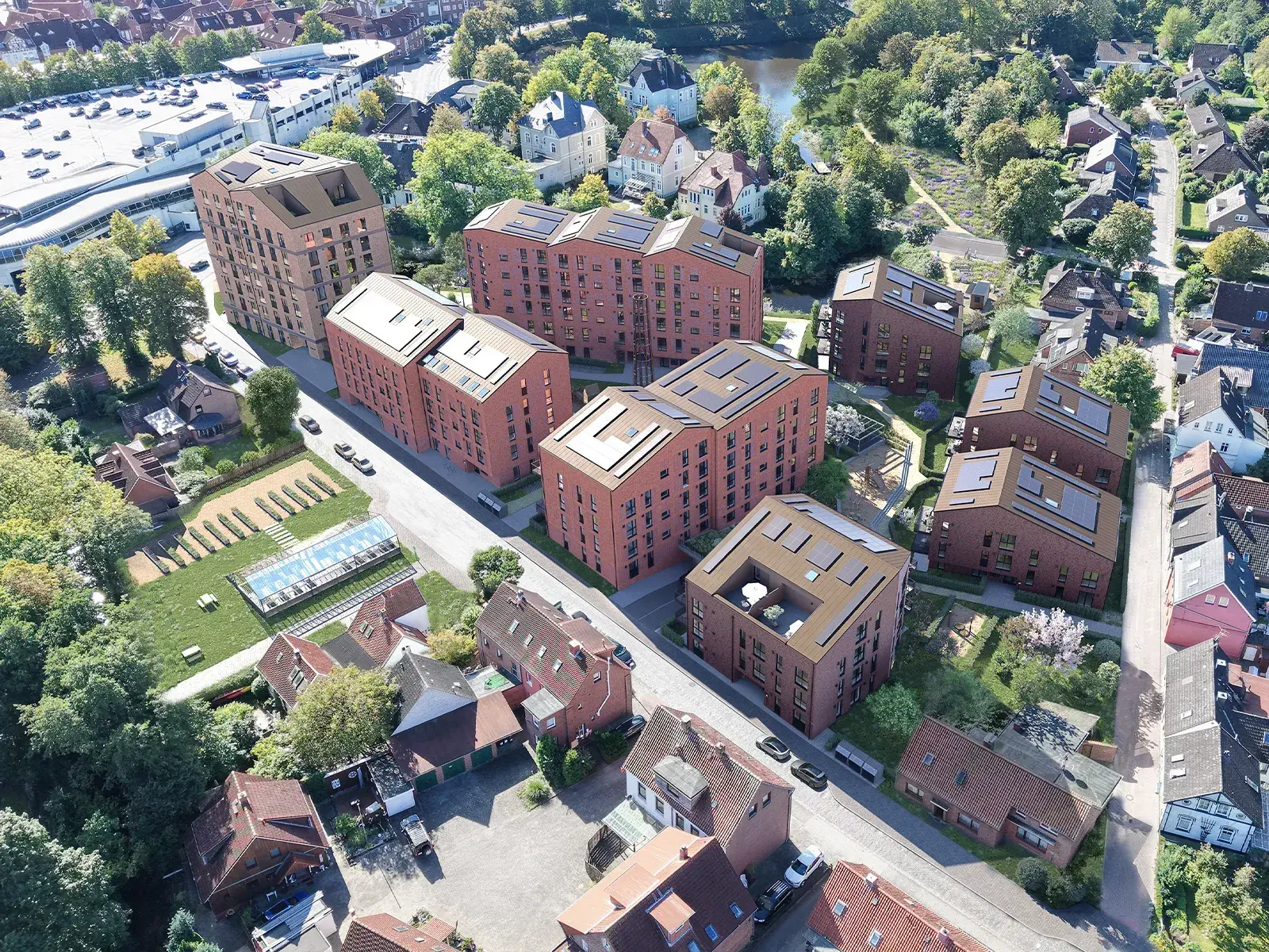 Architekturvisualisierung des Gummischmidt-Quartiers in Stade aus der Vogelperspektive mit Klinkergebäuden und Innenhof | build-av.de
